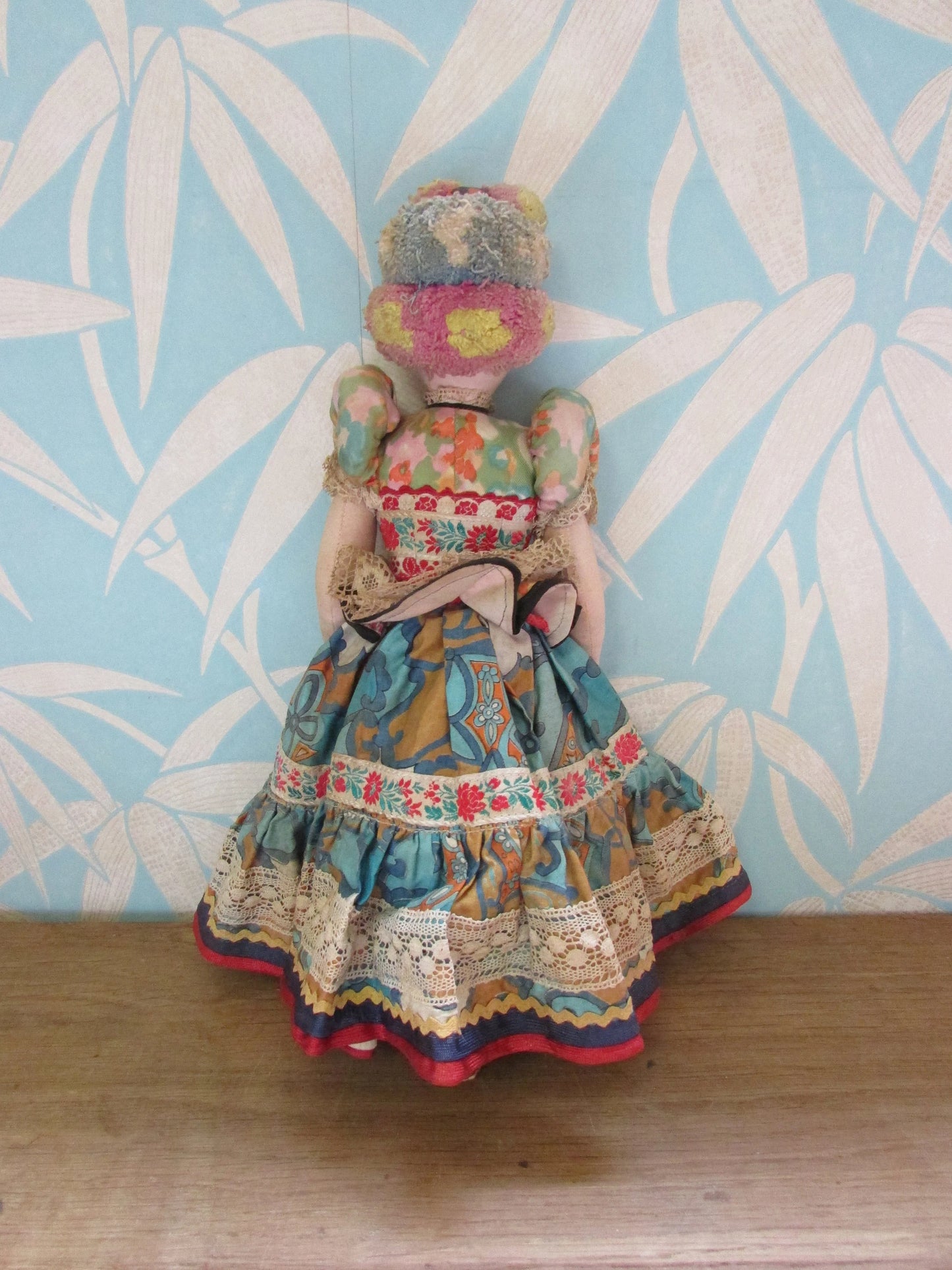 Vintage Hungarian folk art doll in traditional dress, with handpainted porcelain face, & cloth limbs