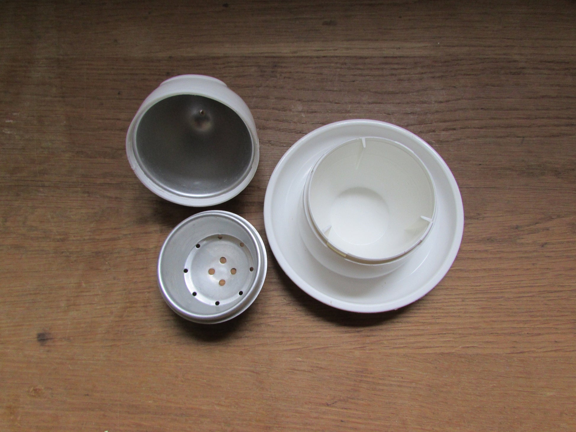 Retro white plastic microwaveable chicken-shaped egg poacher