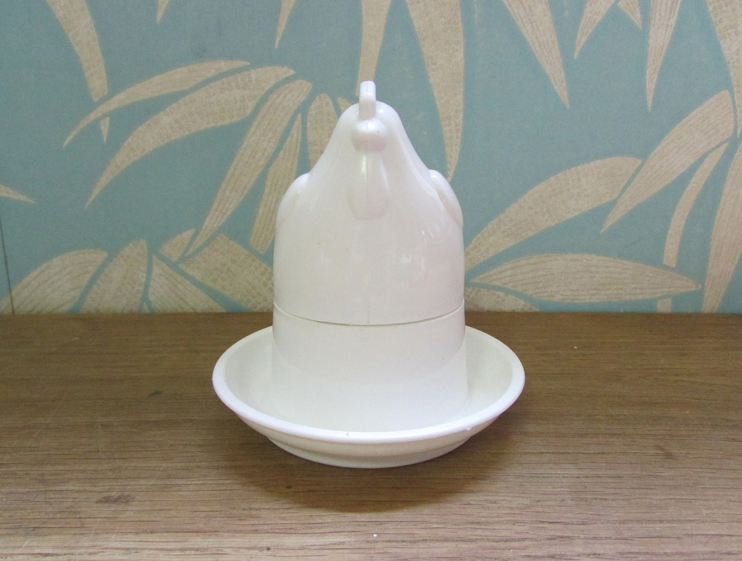 Retro white plastic microwaveable chicken-shaped egg poacher