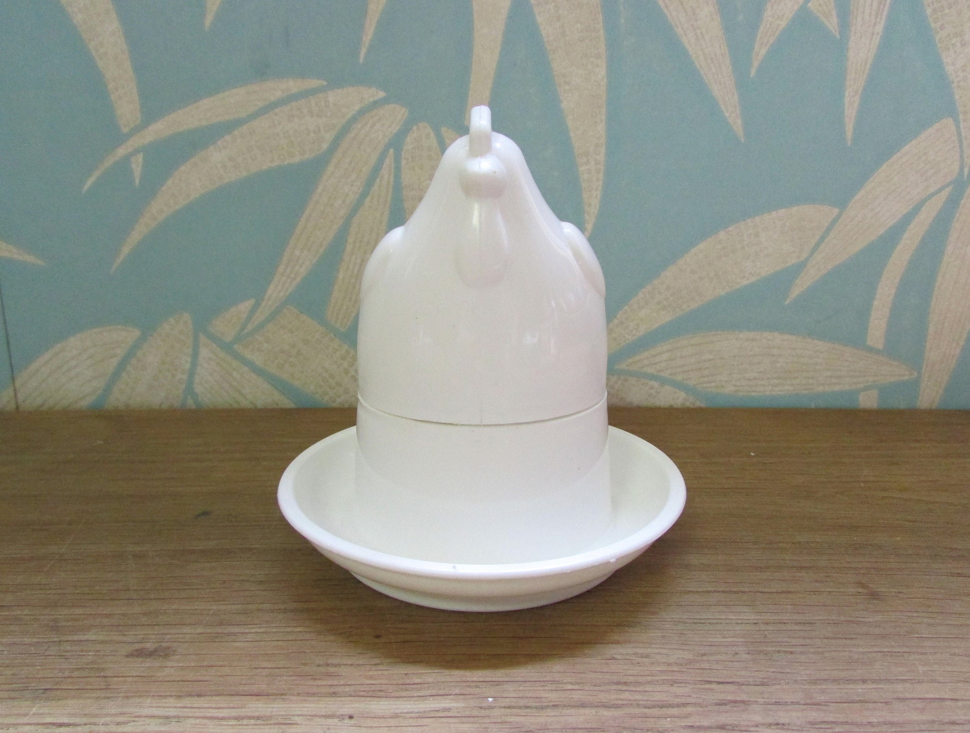 Retro white plastic microwaveable chicken-shaped egg poacher