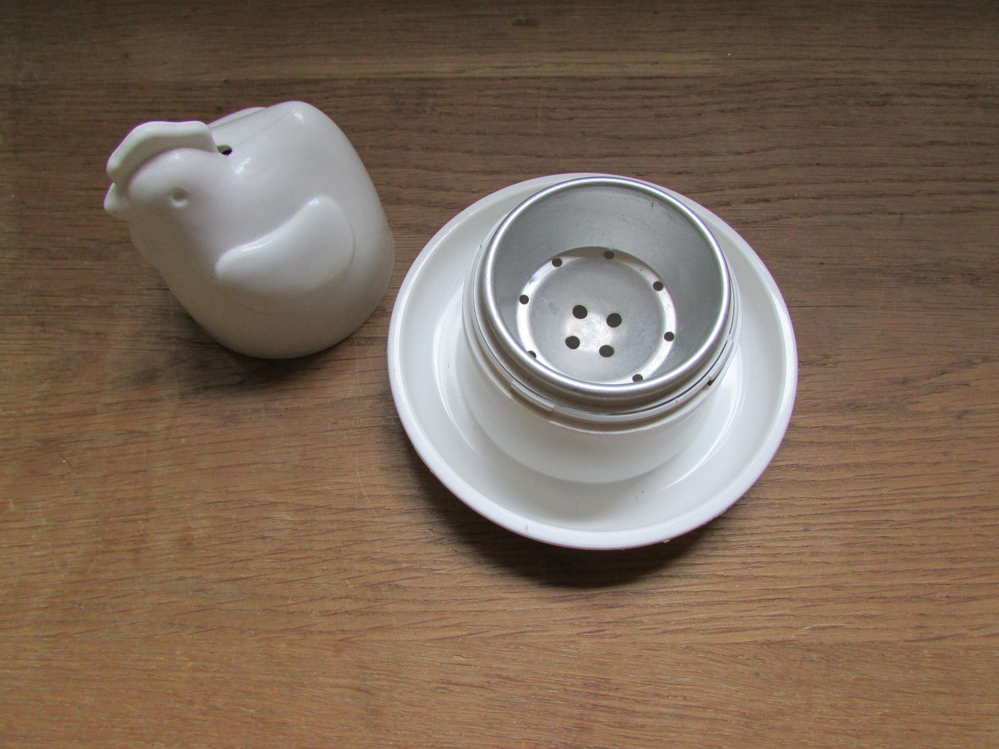 Retro white plastic microwaveable chicken-shaped egg poacher
