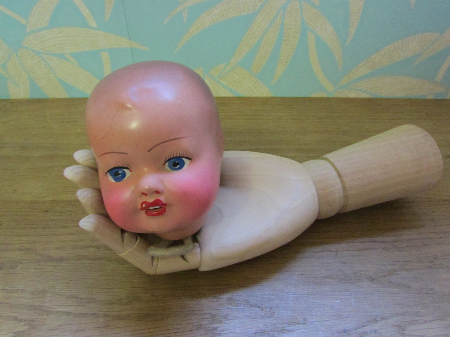 Three antique porcelain baby doll heads - with or without vintage bottle crate
