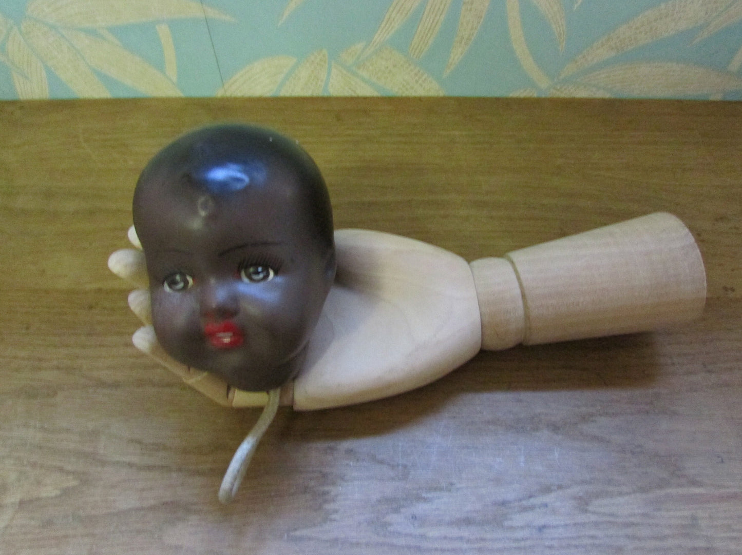 Three antique porcelain baby doll heads - with or without vintage bottle crate