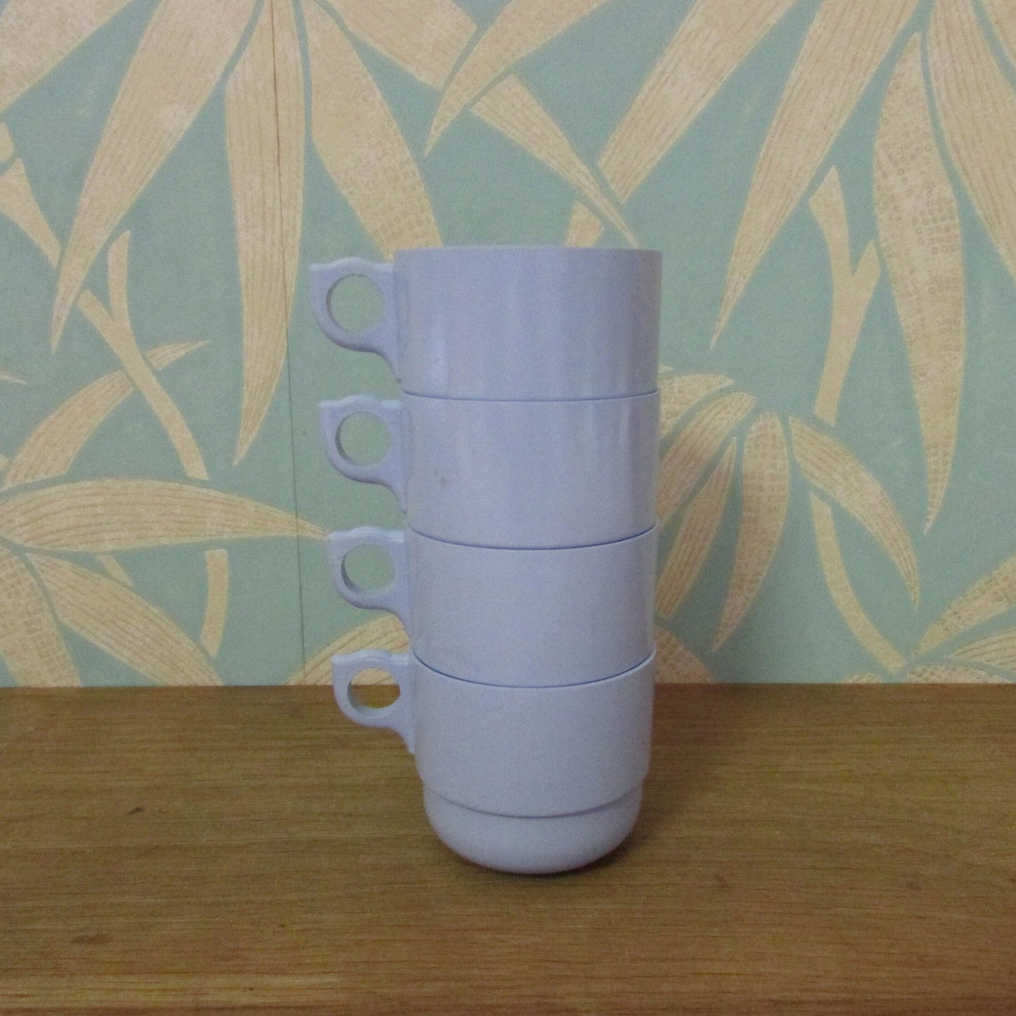 Set of four 1960s pale blue plastic stacking picnic mugs