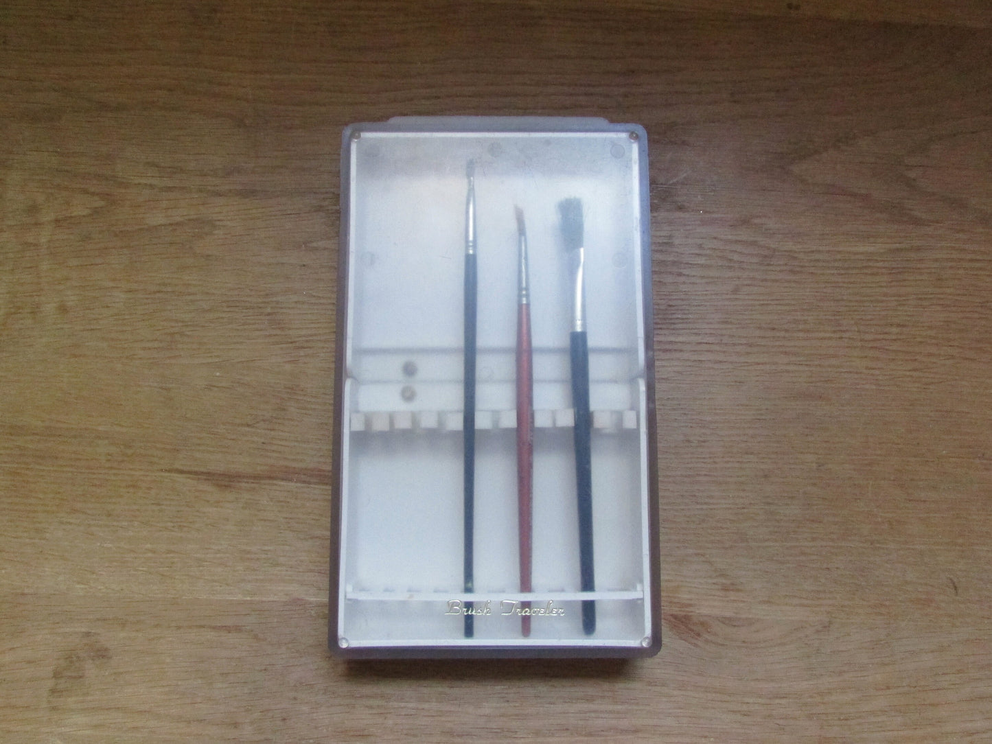 Vintage plastic 'Brush Traveler' paint brush holder