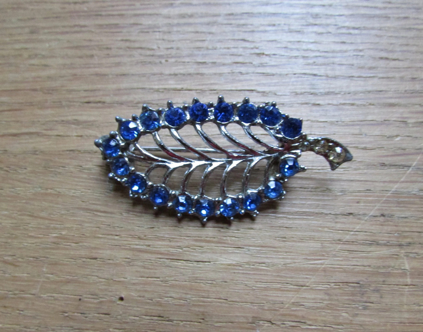 1960s silver-tone skeletal leaf brooch, sapphire blue & clear diamanté