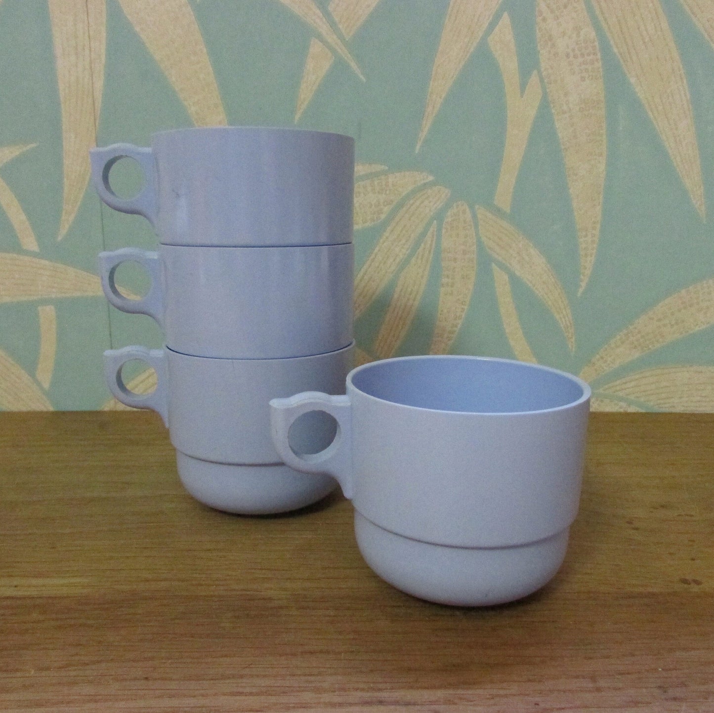 Set of four 1960s pale blue plastic stacking picnic mugs
