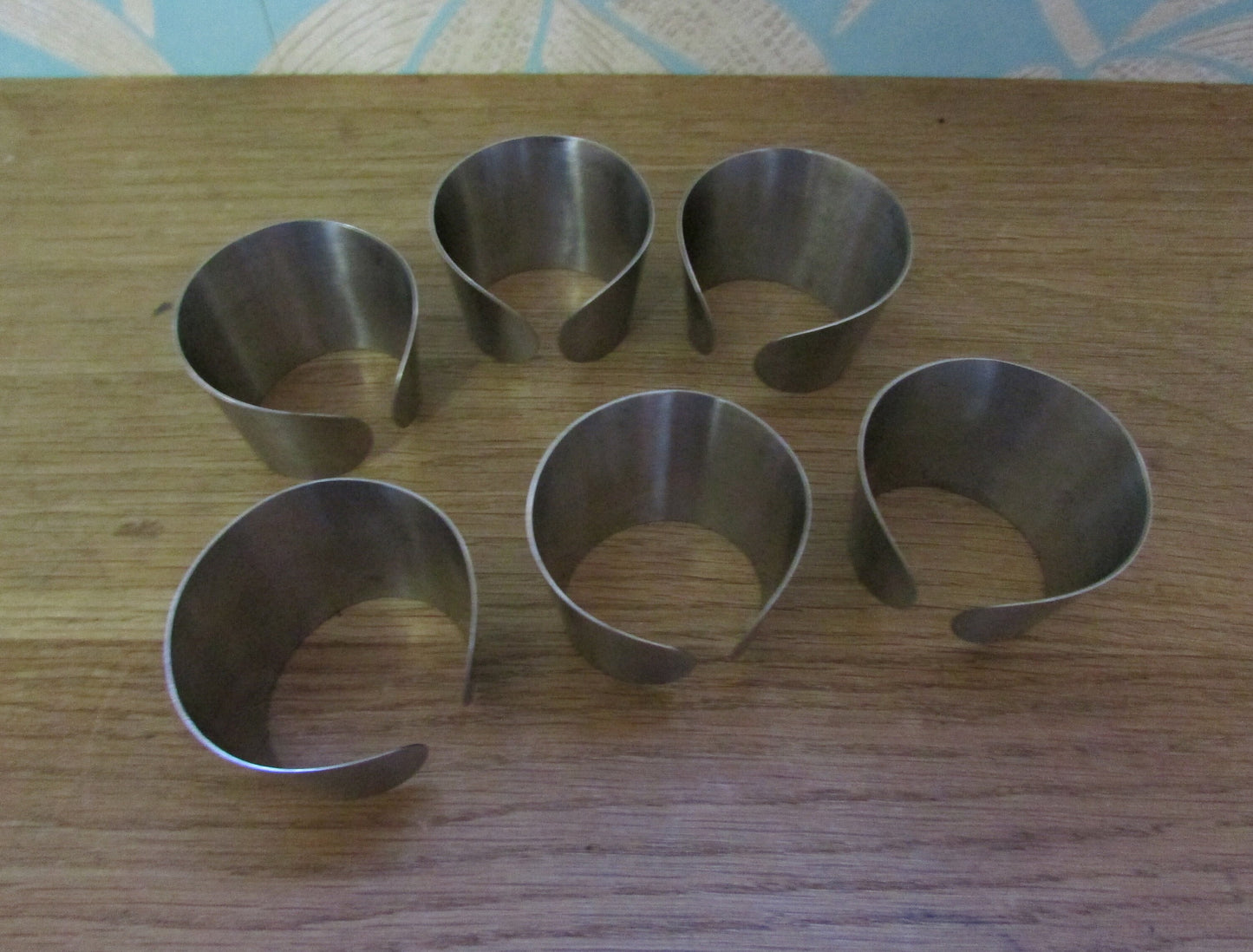 Set of 6 1970s stainless steel cuff napkin rings