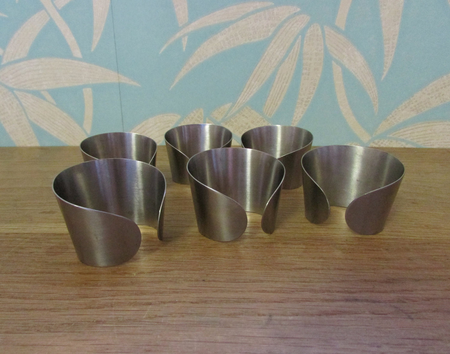 Set of 6 1970s stainless steel cuff napkin rings