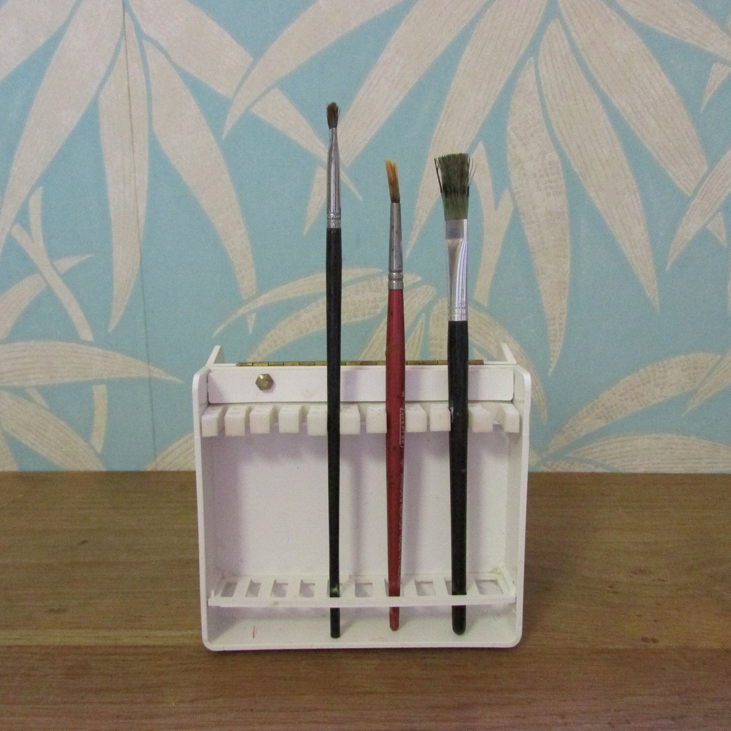 Vintage plastic 'Brush Traveler' paint brush holder