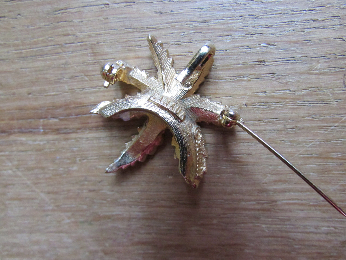 Vintage gold-tone palm frond leaf brooch, stamped CANADA