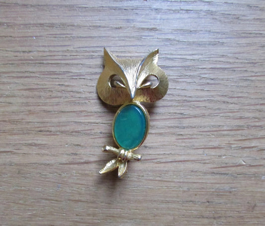Vintage Liz Clairborne modernist-style gold-tone owl brooch with green cabochon belly