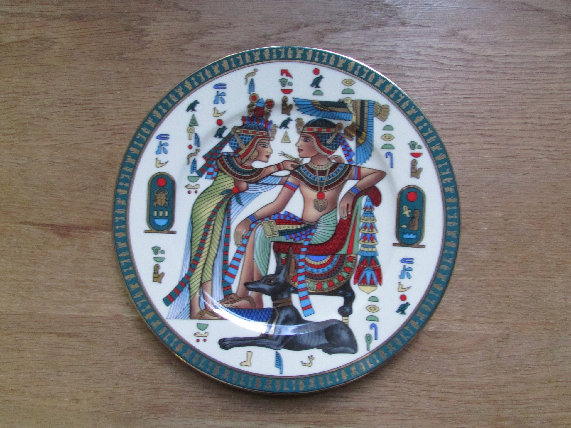 Collectable vintage Fathi Mahmoud Egyptian Limoges porcelain decorative plate depicting King Tutankhamun and Ankhesenamen