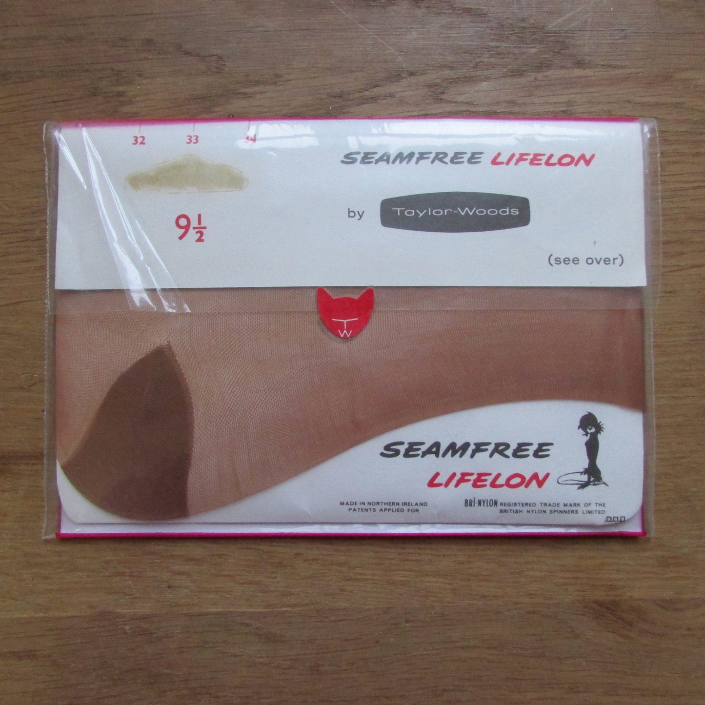 Pair of 1960sTaylor-Woods seam-free 33 Aran Amber bri-nylon stockings, size 9.5
