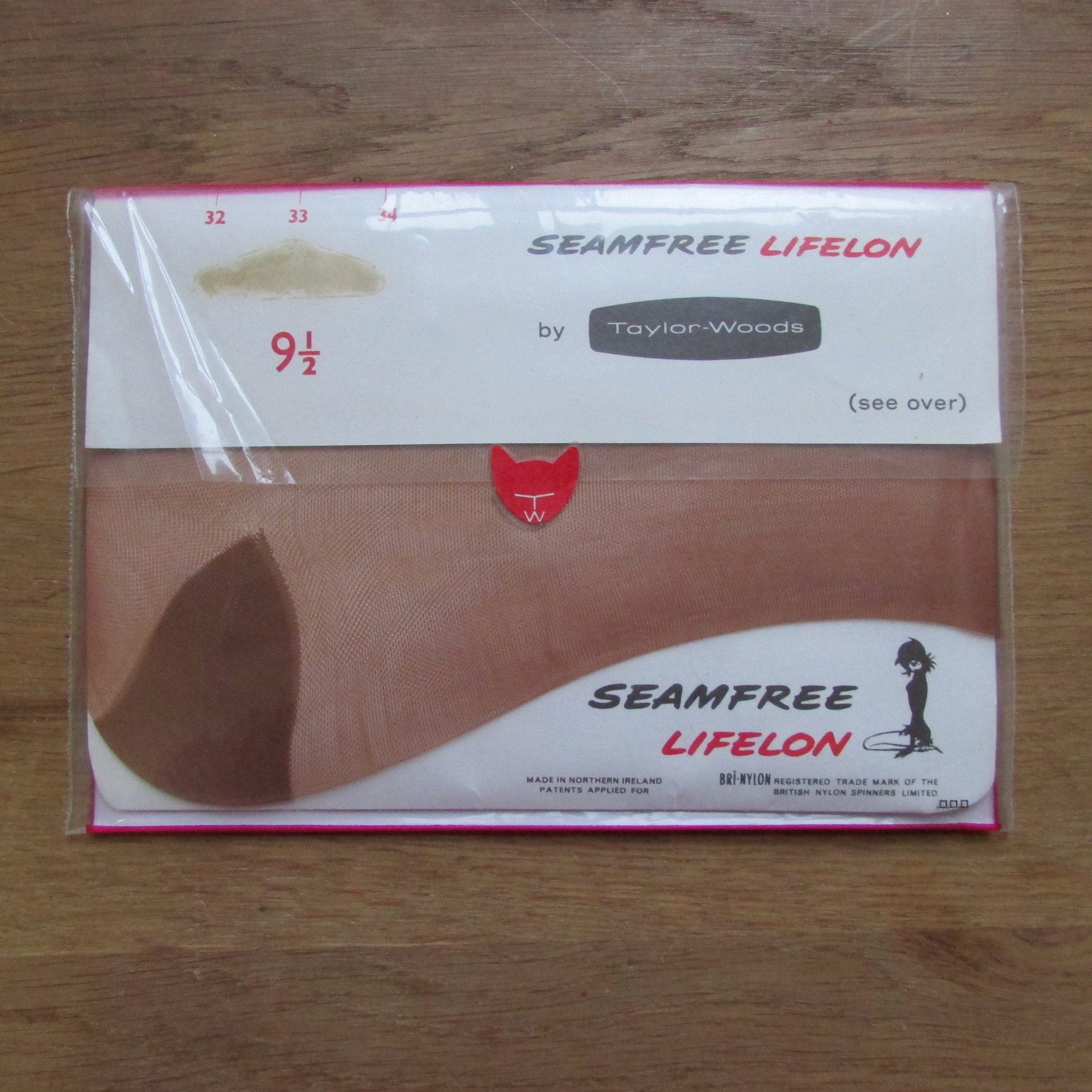 Pair of 1960sTaylor-Woods seam-free 33 Aran Amber bri-nylon stockings, size 9.5