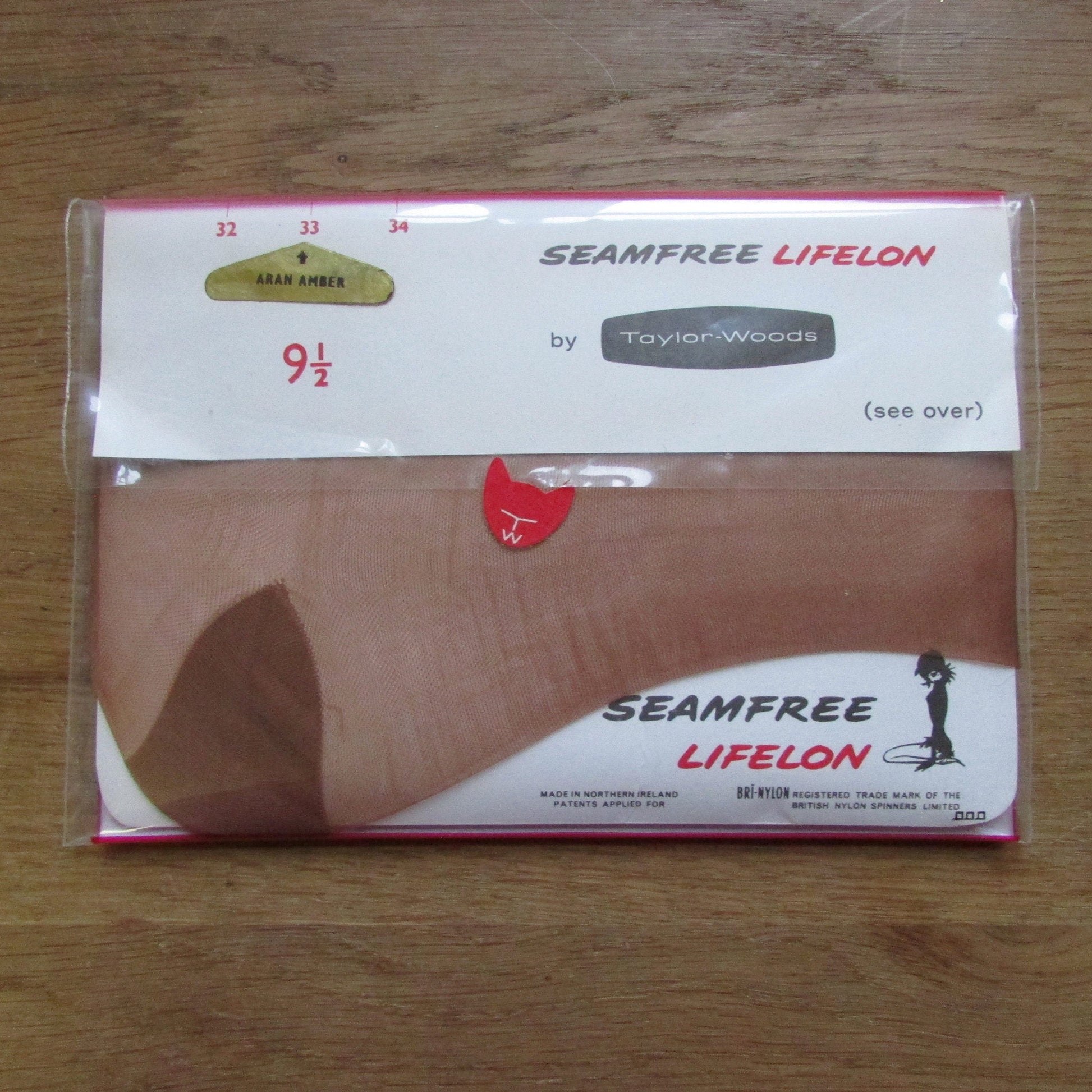 Pair of 1960sTaylor-Woods seam-free 33 Aran Amber bri-nylon stockings, size 9.5