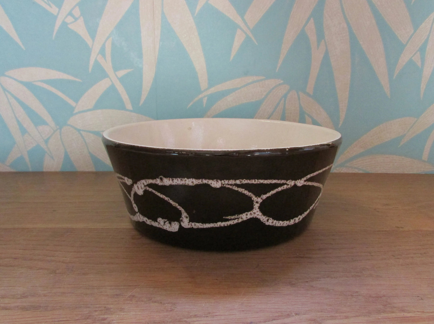 1970s large stoneware pate dish, black with white curved linear pattern
