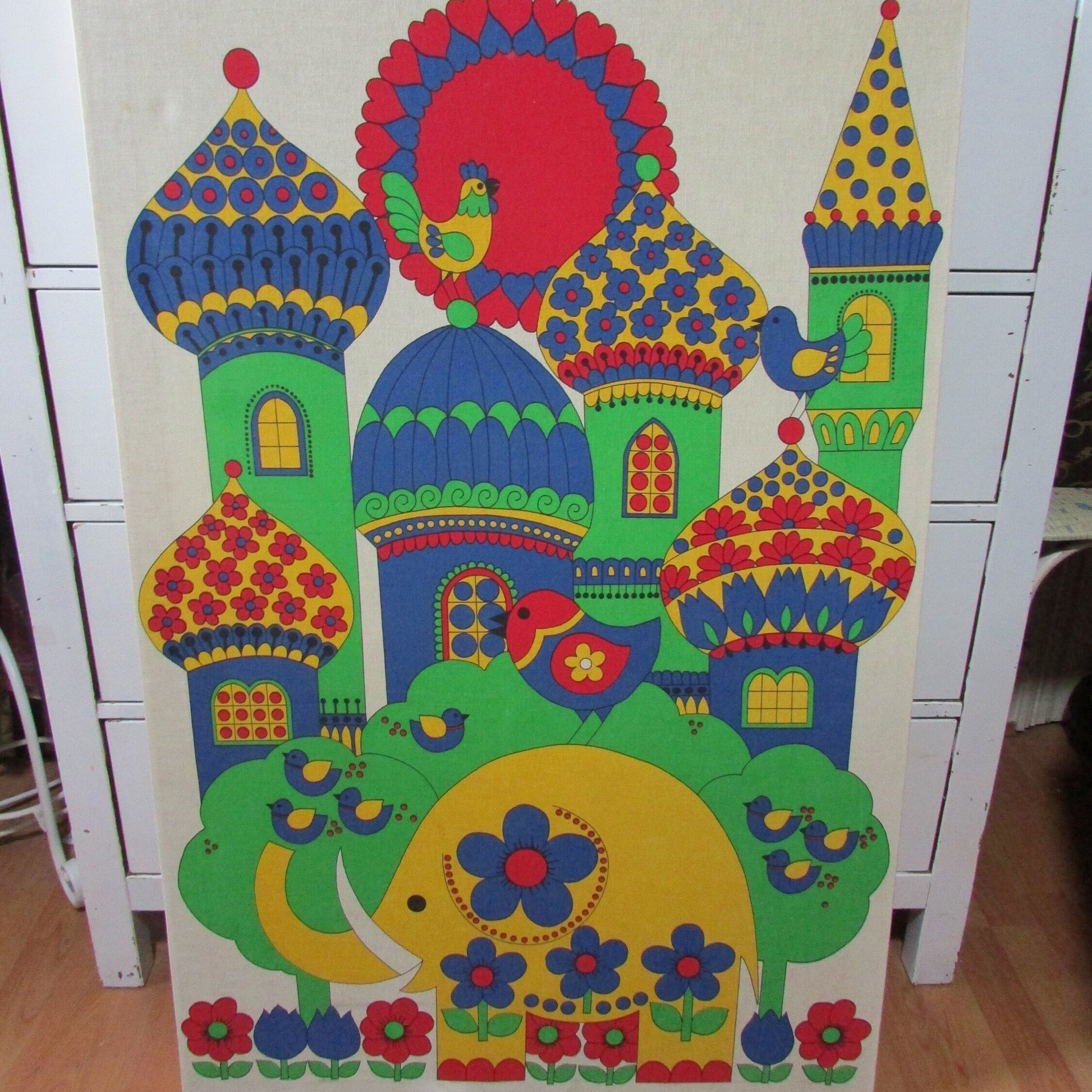 Large 1970s fabric wall hanging of yellow elephant and colourful buildings