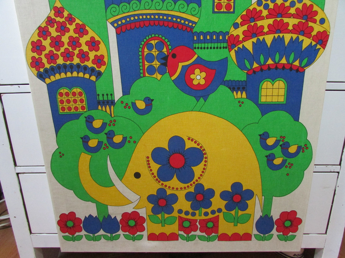 Large 1970s fabric wall hanging of yellow elephant and colourful buildings