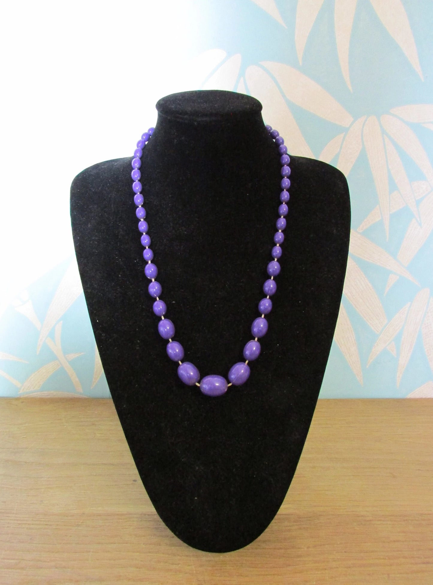 1980s purple plastic graduating oval bead necklace