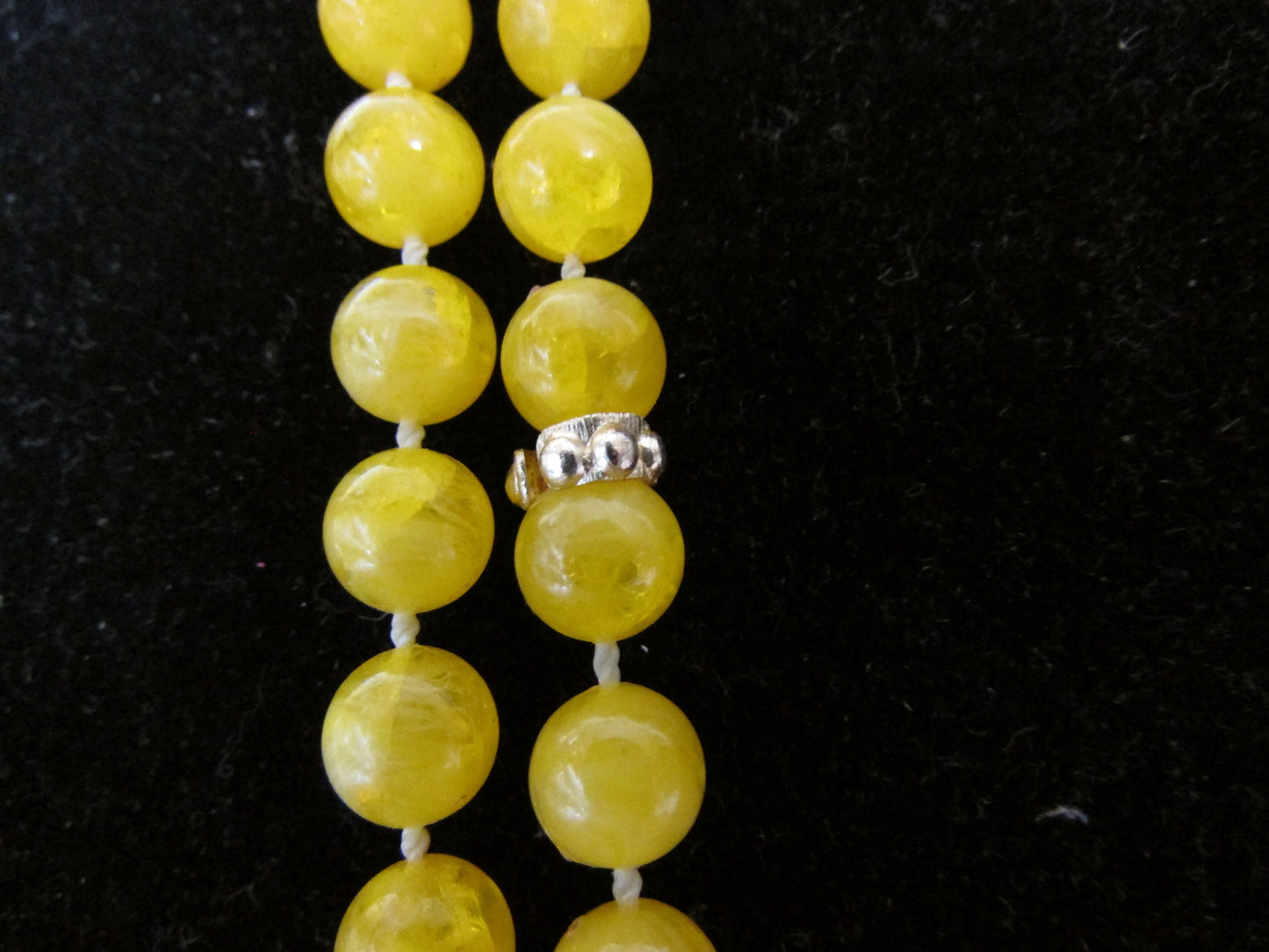 1950s yellow plastic round bead rope necklace with silver-tone spacers
