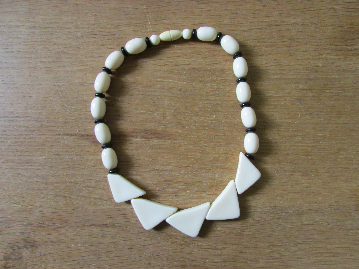 1960s white plastic geometric triangular bead necklace with black spacer beads
