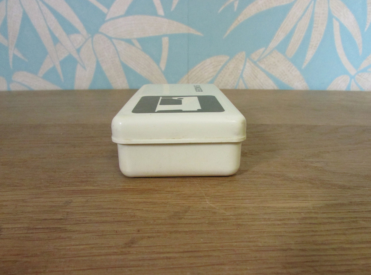 Collectable 1970s Singer hard plastic case containing sewing machine accessories
