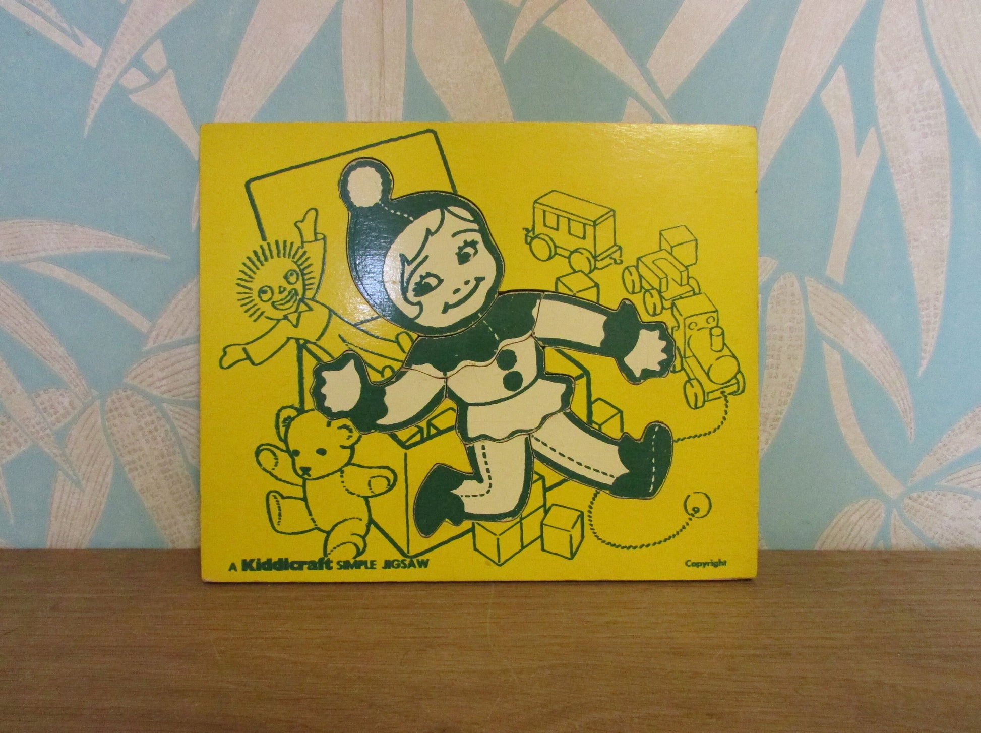 1970s A Kiddicraft Simple Jigsaw (child with toybox) wooden tray puzzle
