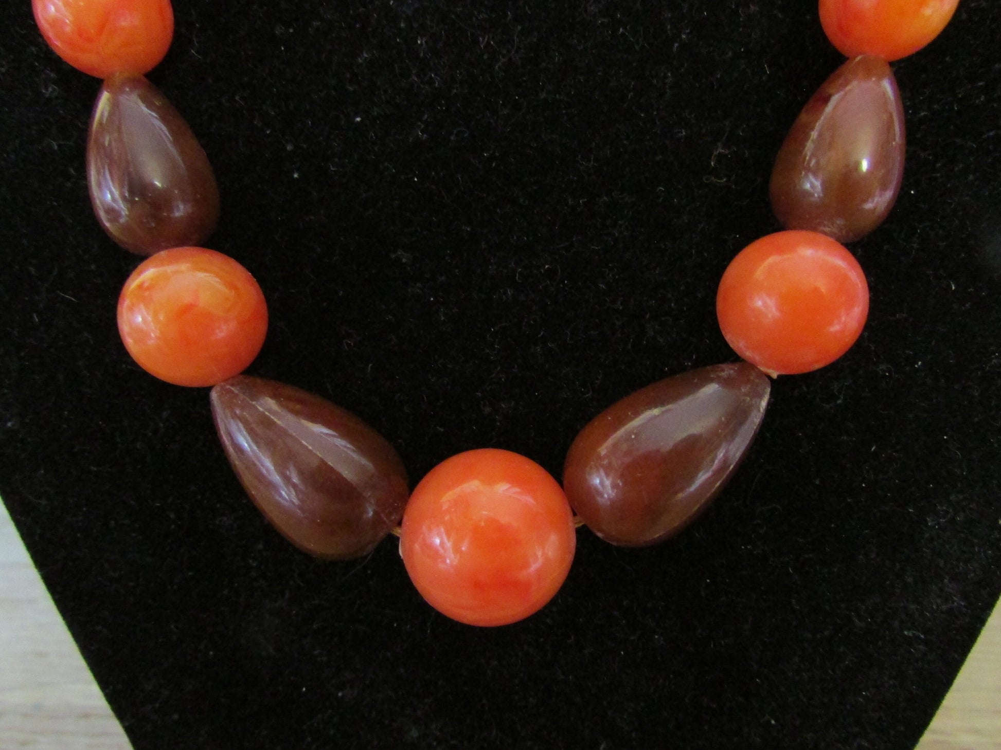 1960s orange & brown marbled plastic teardrop bead necklace with hidden clasp