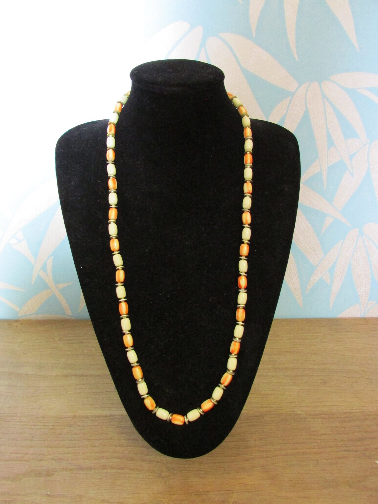 1960s/70s cream & orange marbled resin cylinder bead necklace with gold-tone spacers