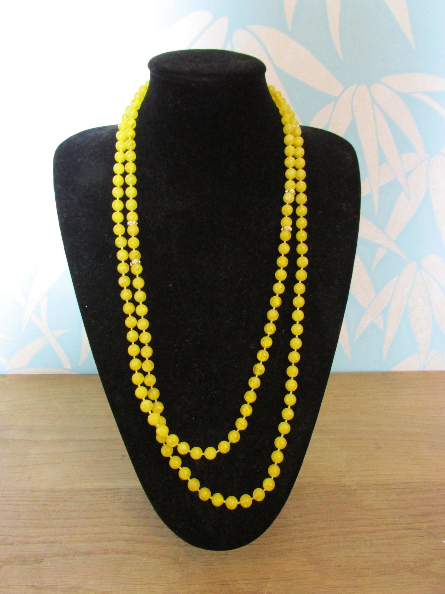 1950s yellow plastic round bead rope necklace with silver-tone spacers