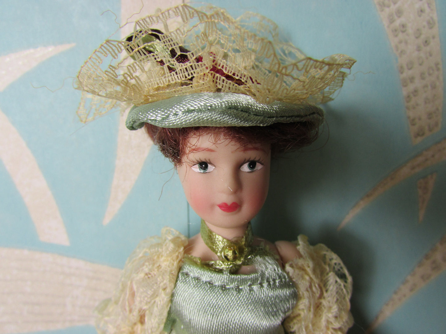 Vintage miniature porcelain doll's house doll in traditional Victorian dress
