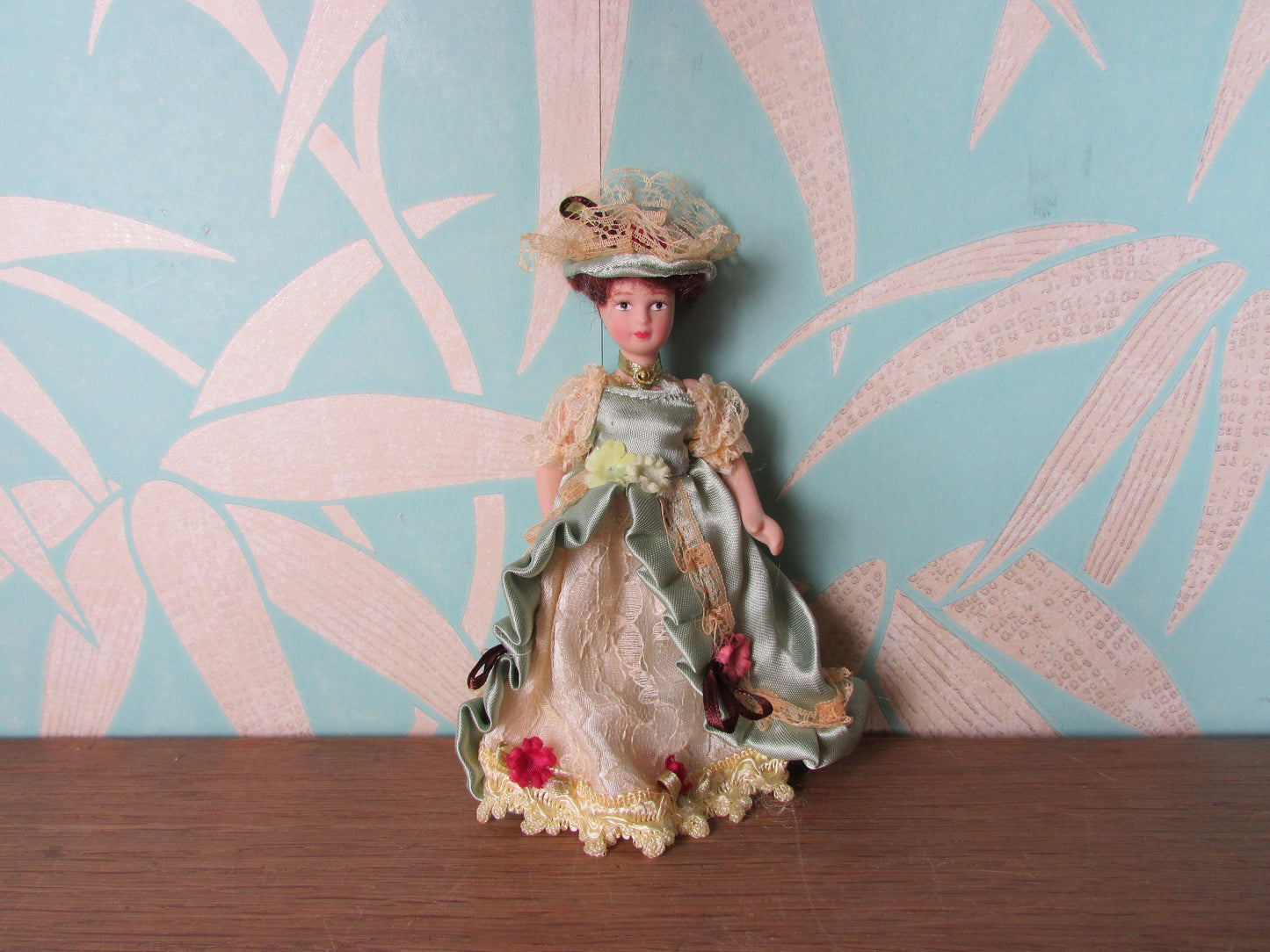 Vintage miniature porcelain doll's house doll in traditional Victorian dress