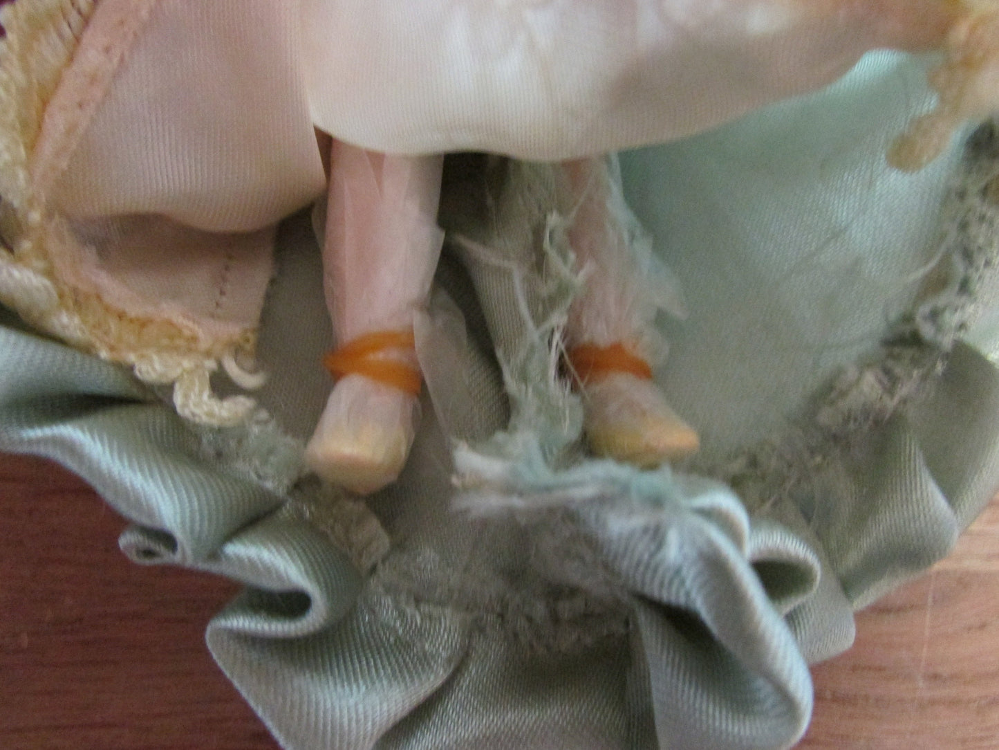 Vintage miniature porcelain doll's house doll in traditional Victorian dress