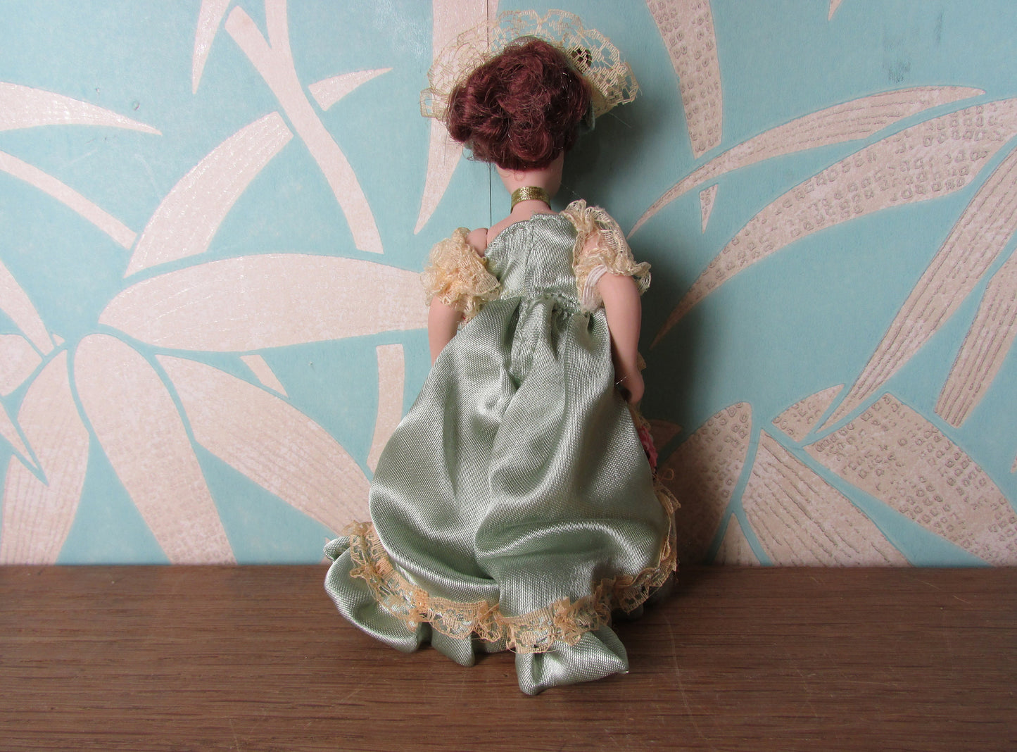 Vintage miniature porcelain doll's house doll in traditional Victorian dress