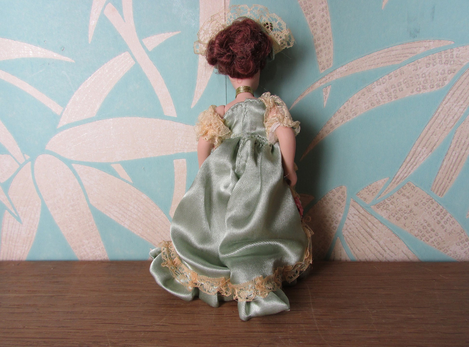 Vintage miniature porcelain doll's house doll in traditional Victorian dress