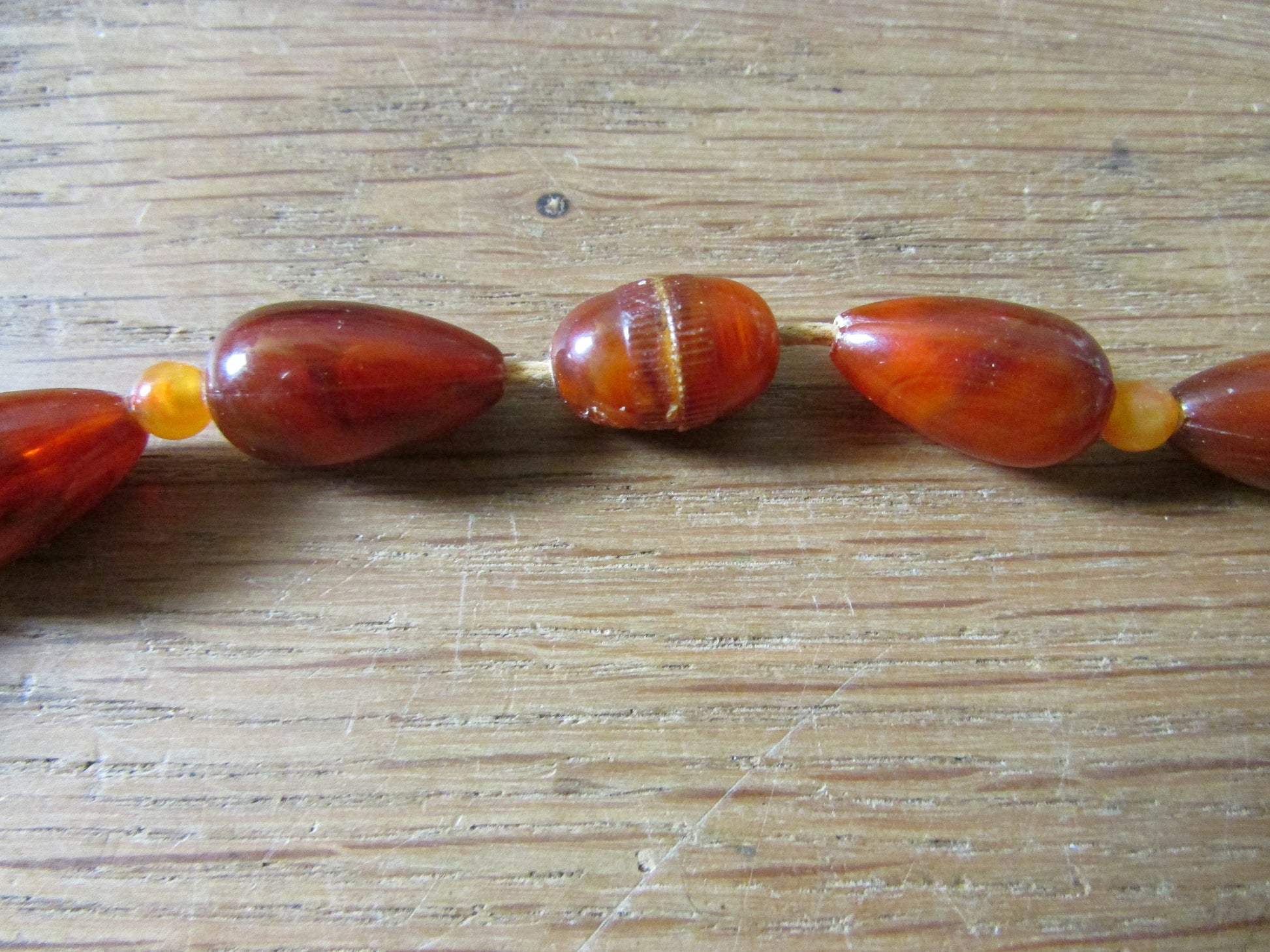 1960s orange & brown marbled plastic teardrop bead necklace with hidden clasp