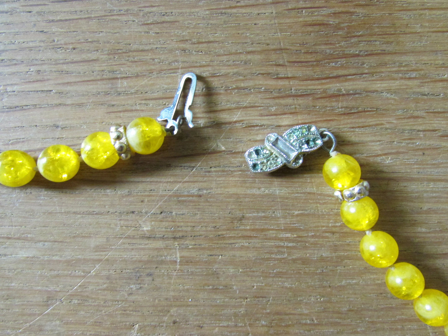 1950s yellow plastic round bead rope necklace with silver-tone spacers
