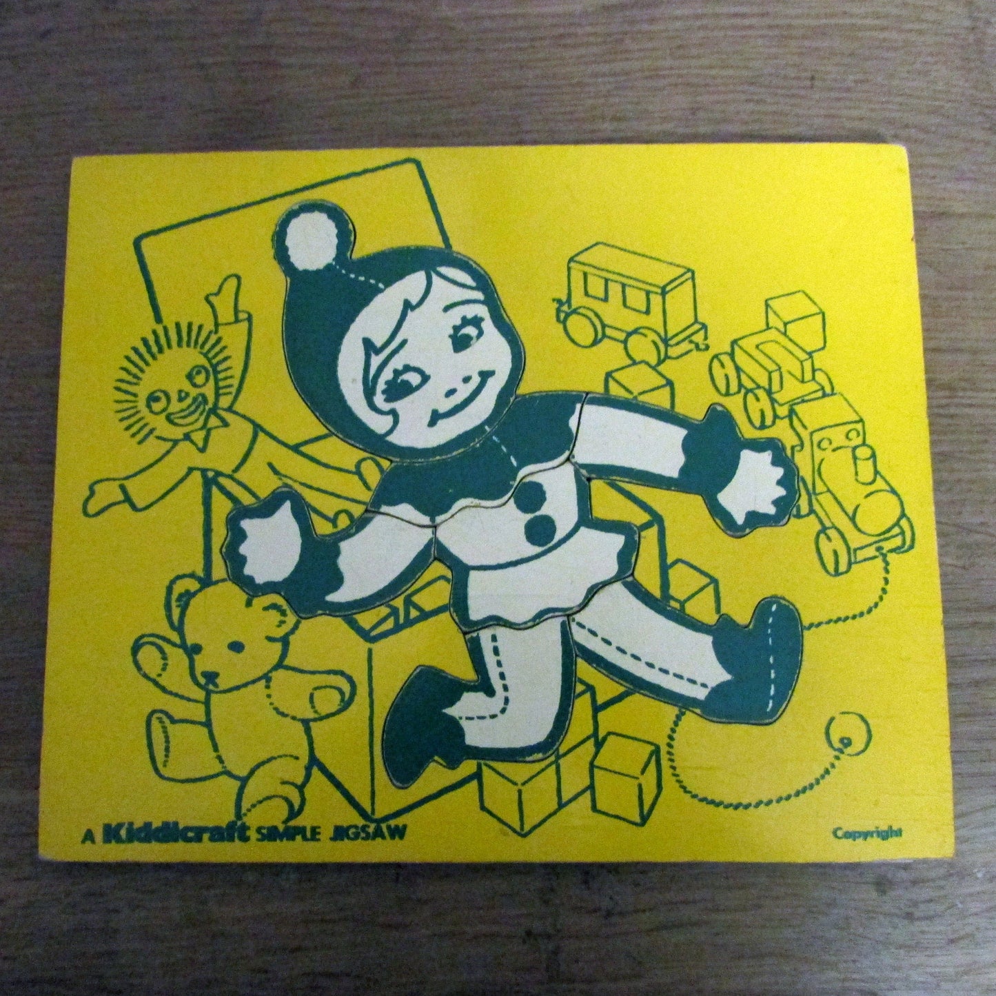 1970s A Kiddicraft Simple Jigsaw (child with toybox) wooden tray puzzle
