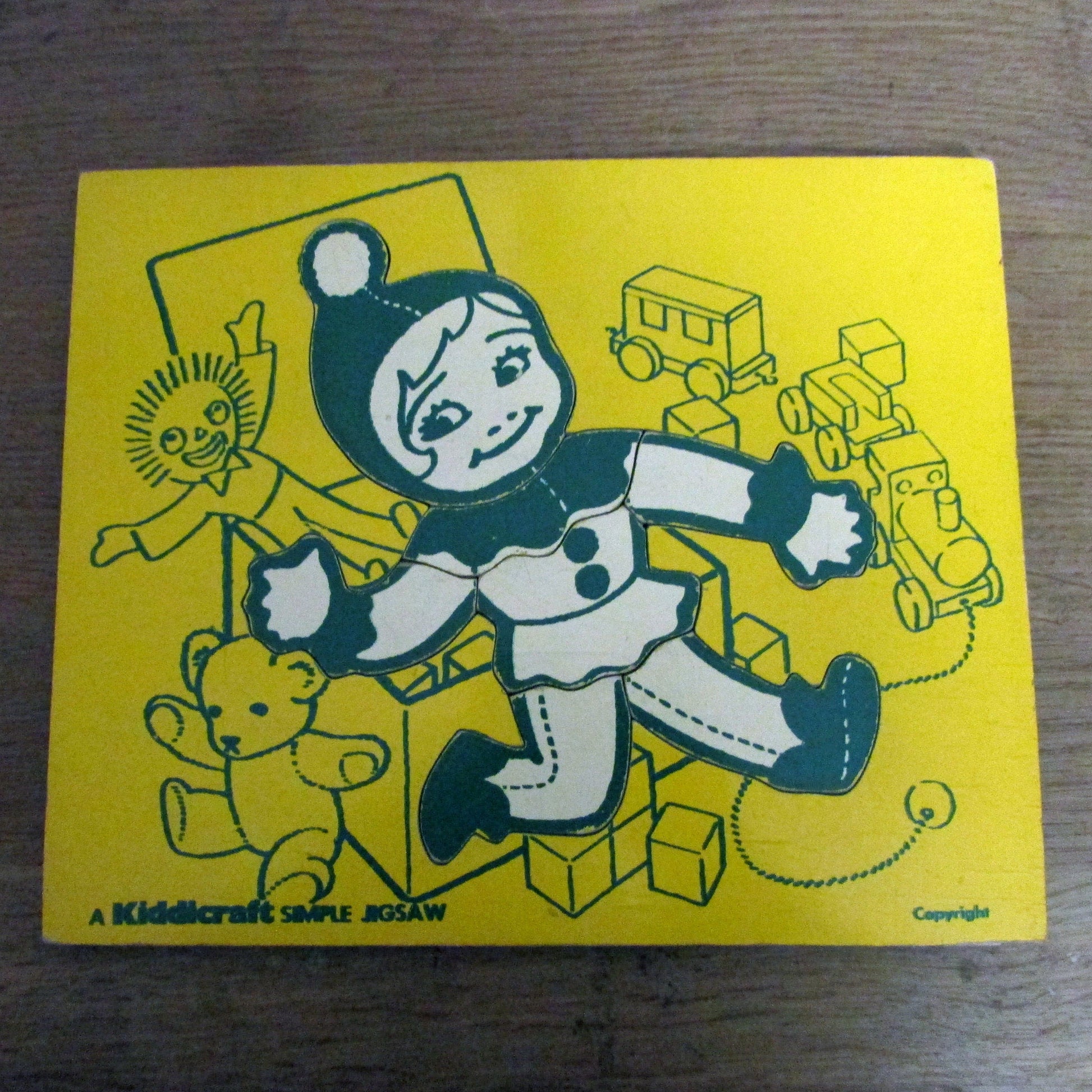 1970s A Kiddicraft Simple Jigsaw (child with toybox) wooden tray puzzle