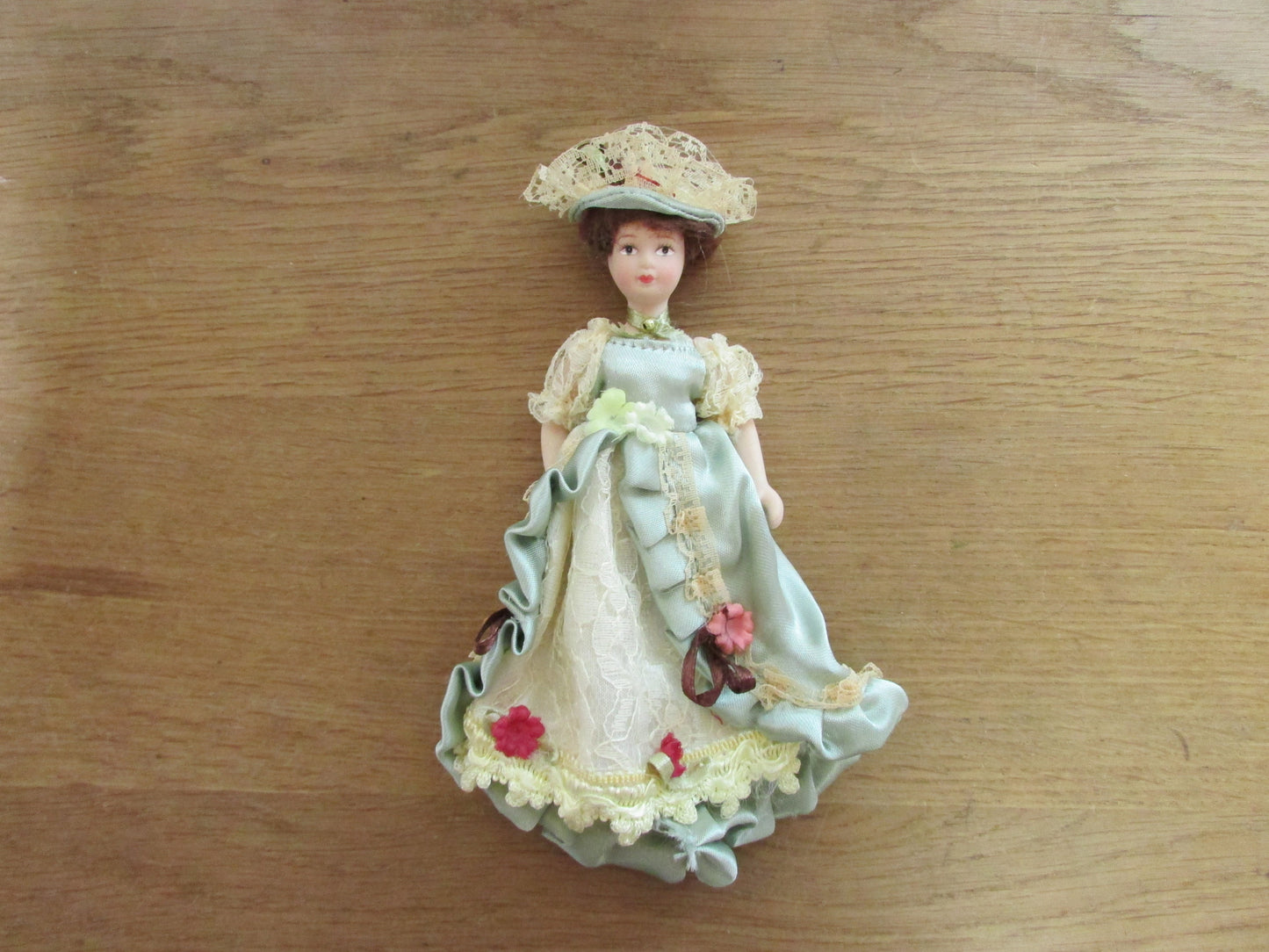 Vintage miniature porcelain doll's house doll in traditional Victorian dress