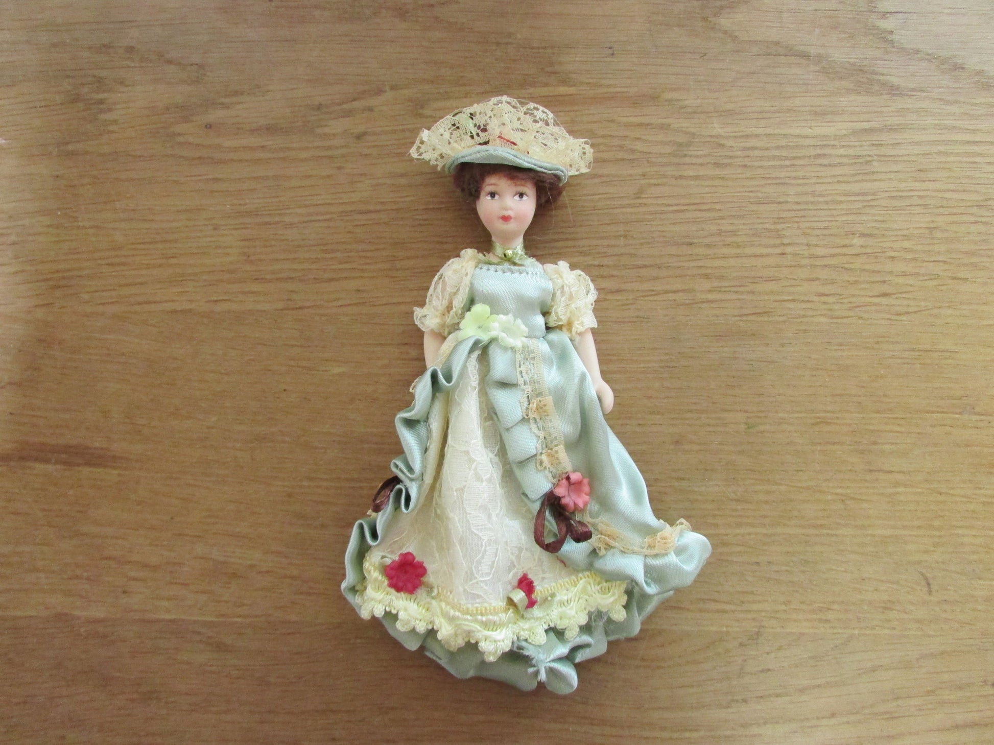 Vintage miniature porcelain doll's house doll in traditional Victorian dress