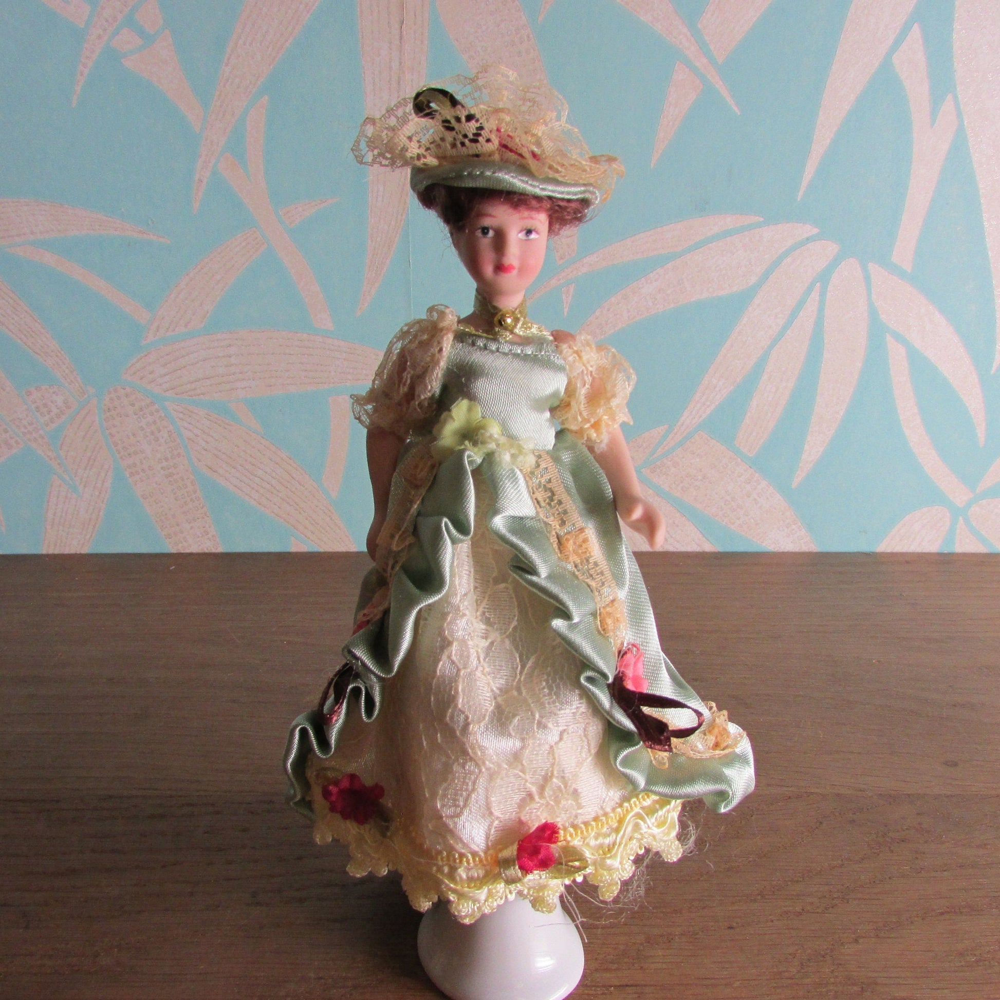 Vintage miniature porcelain doll's house doll in traditional Victorian dress