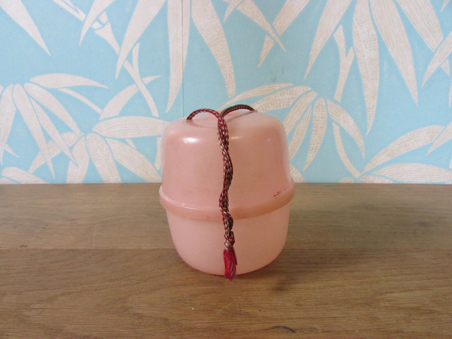 Vintage pink plastic wool/string holder
