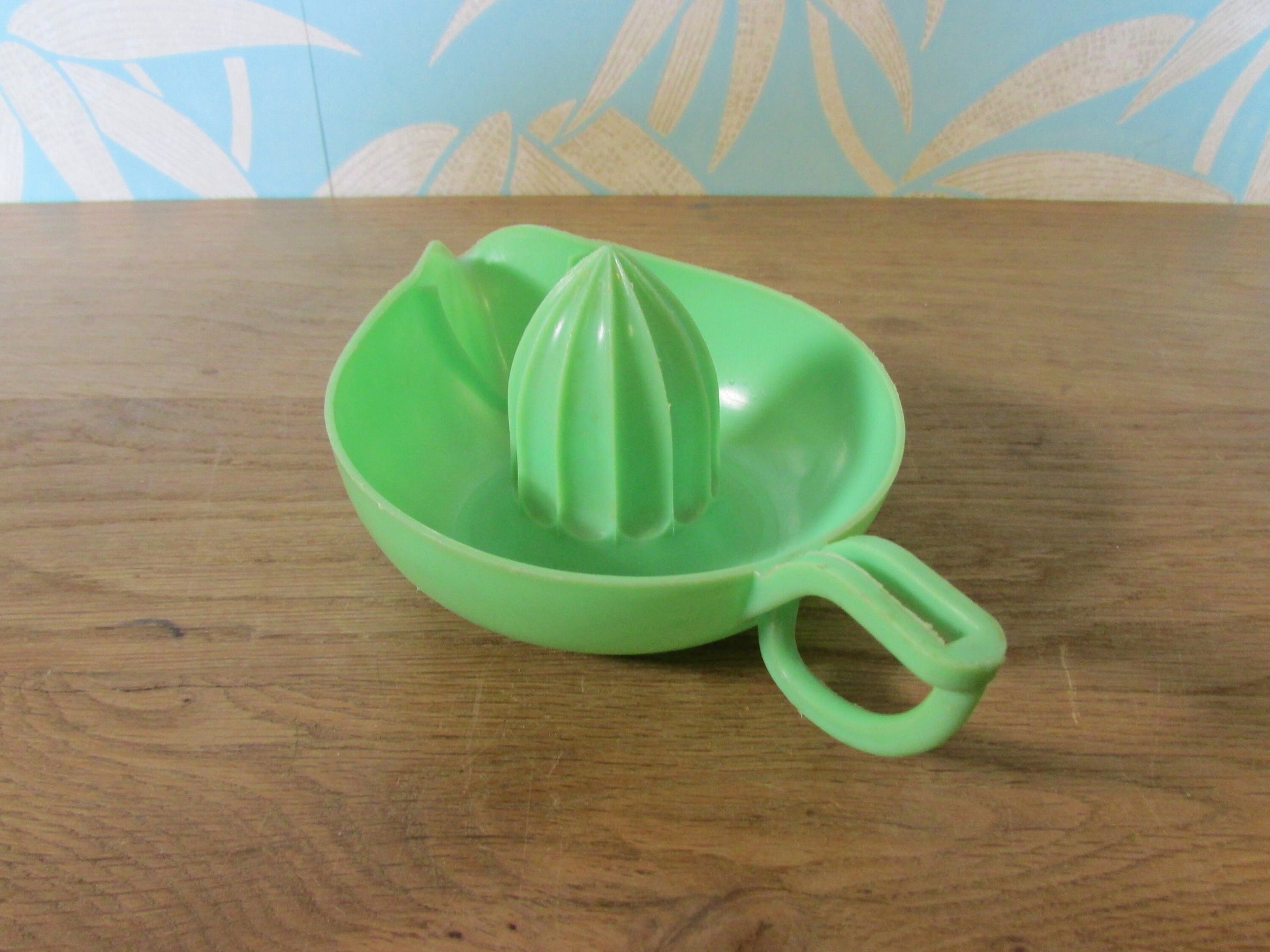 Vintage green plastic citrus juicer