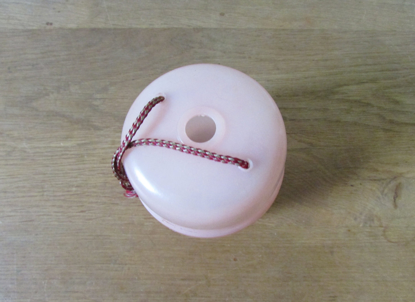 Vintage pink plastic wool/string holder
