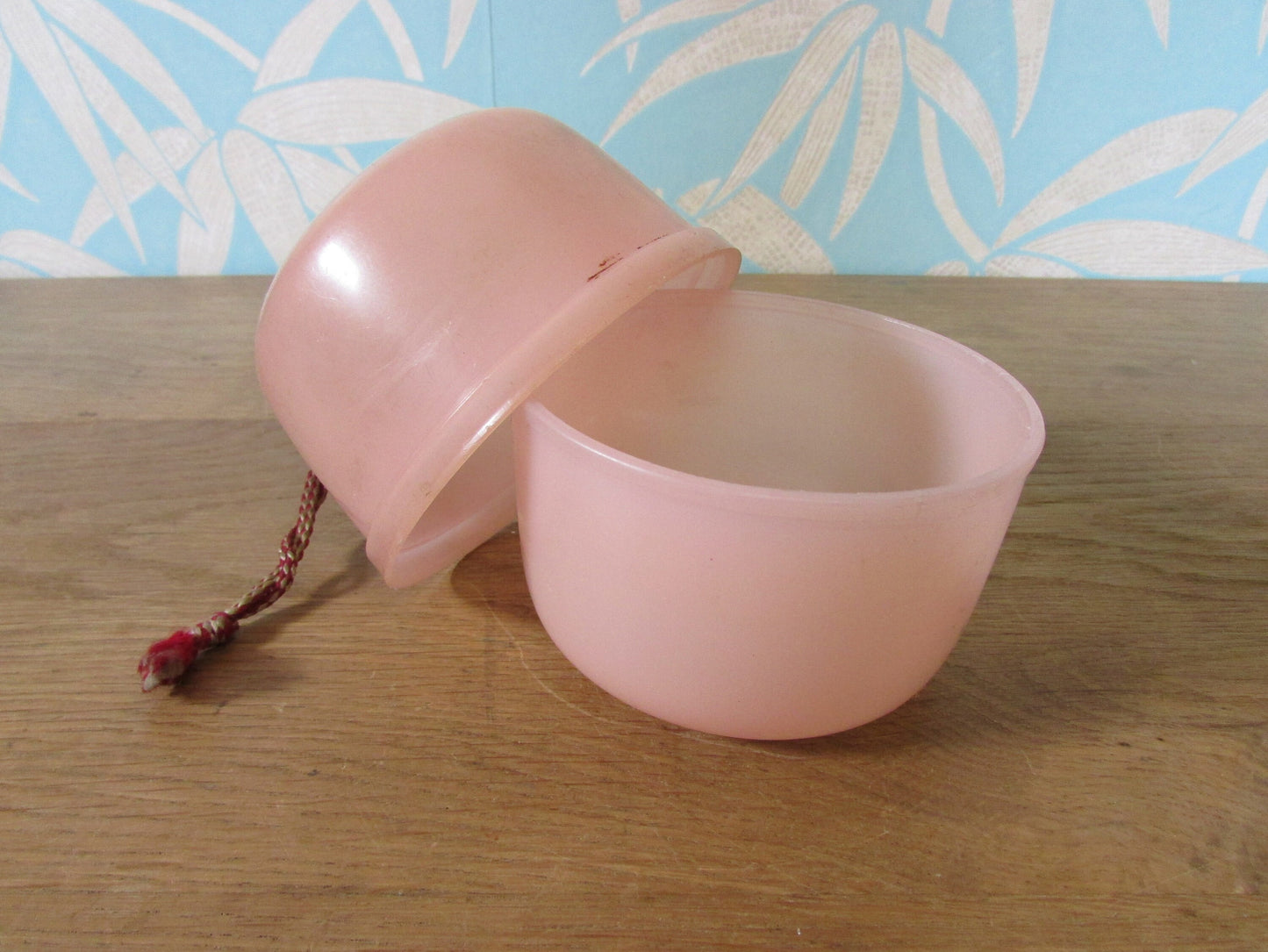 Vintage pink plastic wool/string holder