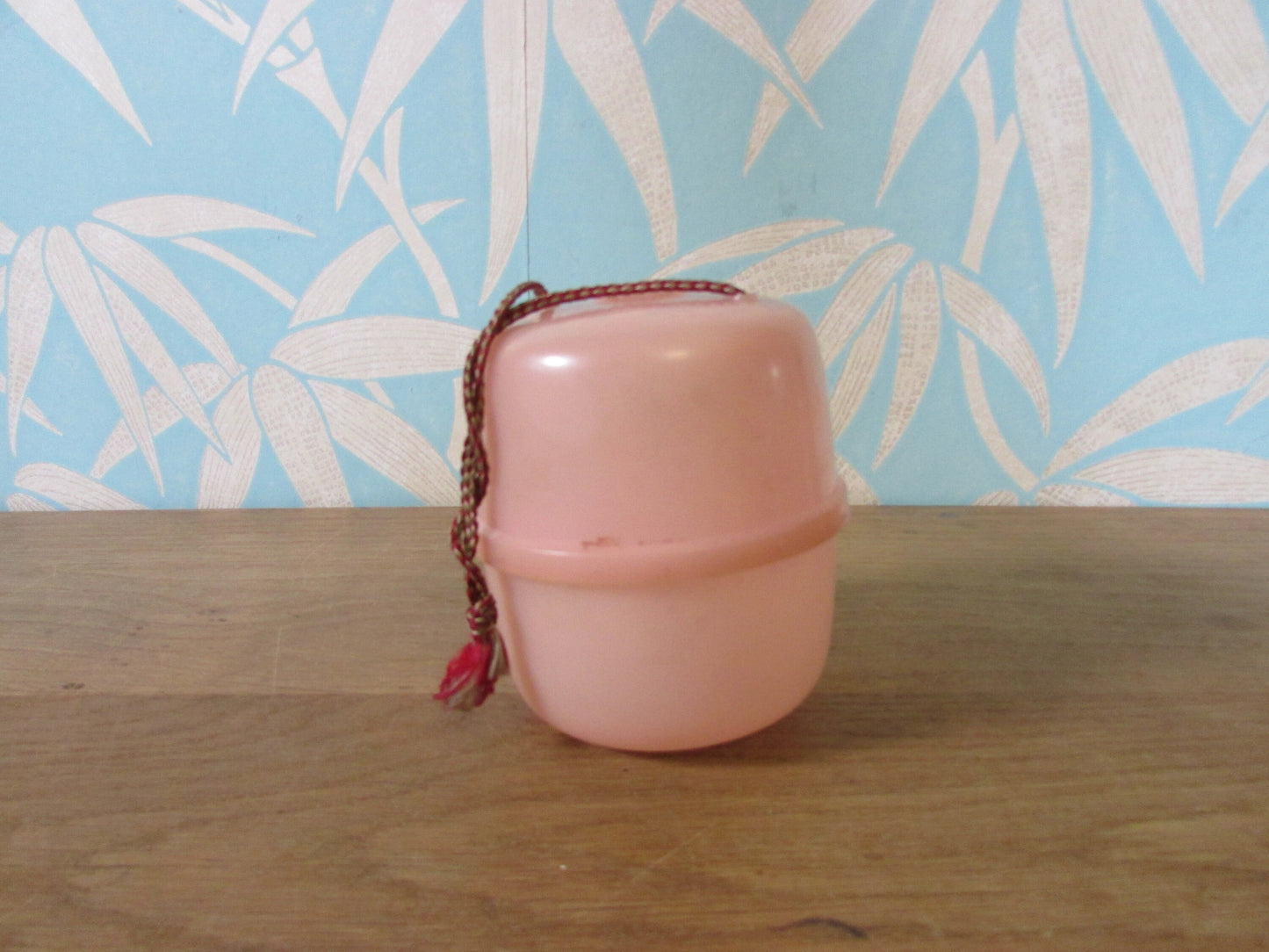 Vintage pink plastic wool/string holder