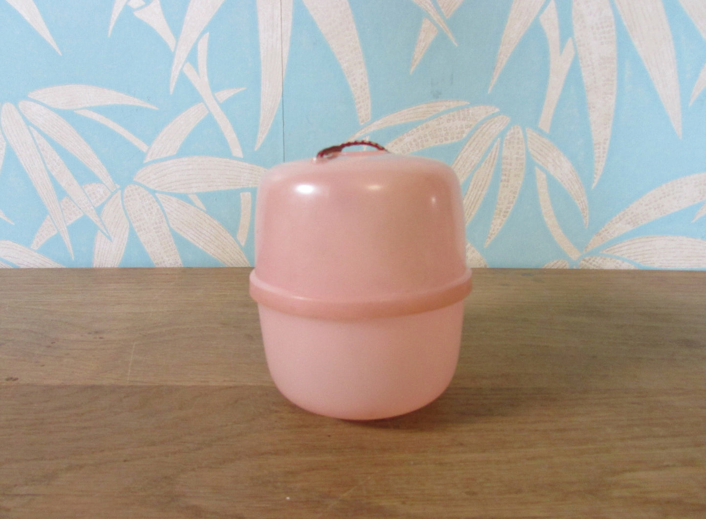 Vintage pink plastic wool/string holder