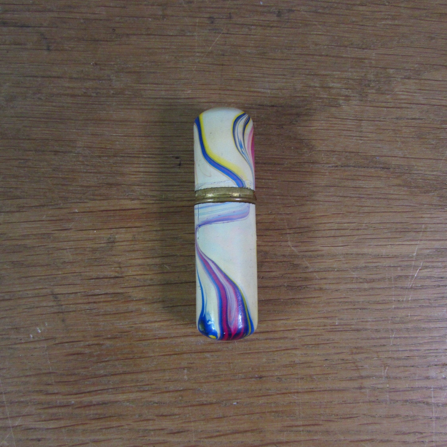 Art Deco marbled brass etui case containing wooden needle holder/thread spool